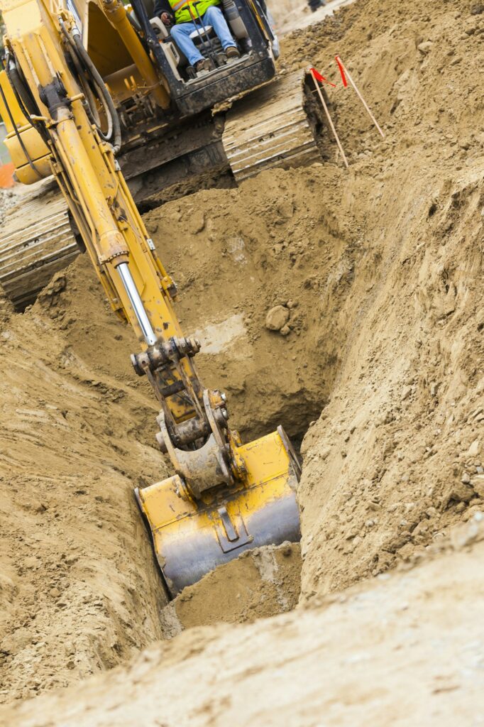 Working Excavator Tractor Digging A Trench.